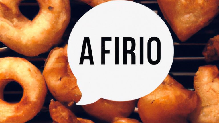 Imagem de um coração feito de carne moída, empanado e frito em uma airfryer. O coração está sobre uma grelha com papel manteiga por baixo. O fundo é branco.