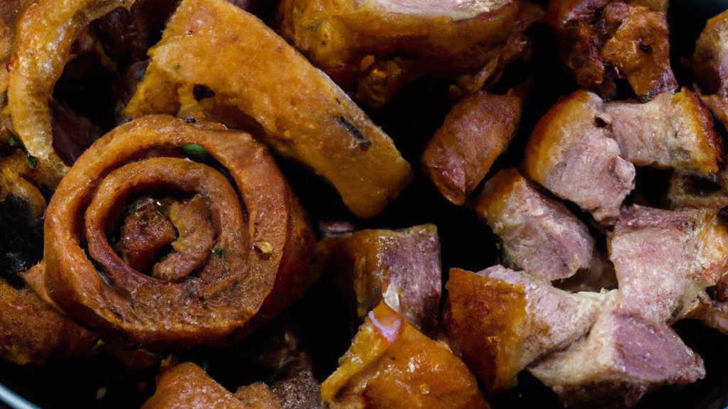 Imagem de uma costela de porco assada na Airfryer, com uma crosta crocante e dourada. A carne é macia e suculenta, e é servida com um molho barbecue caseiro.