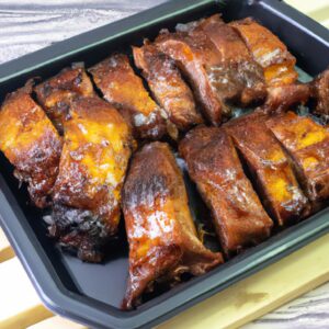 Imagem mostrando um filé de costela grelhado perfeitamente em uma Airfryer. A carne está suculenta e saborosa, com um exterior crocante. A Airfryer é um aparelho conveniente que permite grelhar alimentos com baixo teor de gordura e sem bagunça.