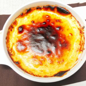 Imagem de filés de salmão grelhados em uma airfryer, acompanhados de brócolis e cenouras refogadas. O salmão está perfeitamente cozido, com uma crosta dourada e crocante, enquanto os vegetais estão crocantes e macios.