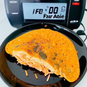 Omelete de cenoura crocante e dourado cozido na airfryer, com uma textura fofa e um interior suculento. Cenouras salteadas adicionam doçura e cor, criando um prato saudável e saboroso.