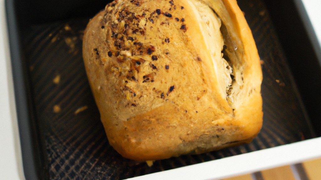 Imagem de um pão de aveia redondo e dourado em uma cesta de vime, com flocos de aveia espalhados ao redor. O pão é fofo e tem uma crosta crocante.