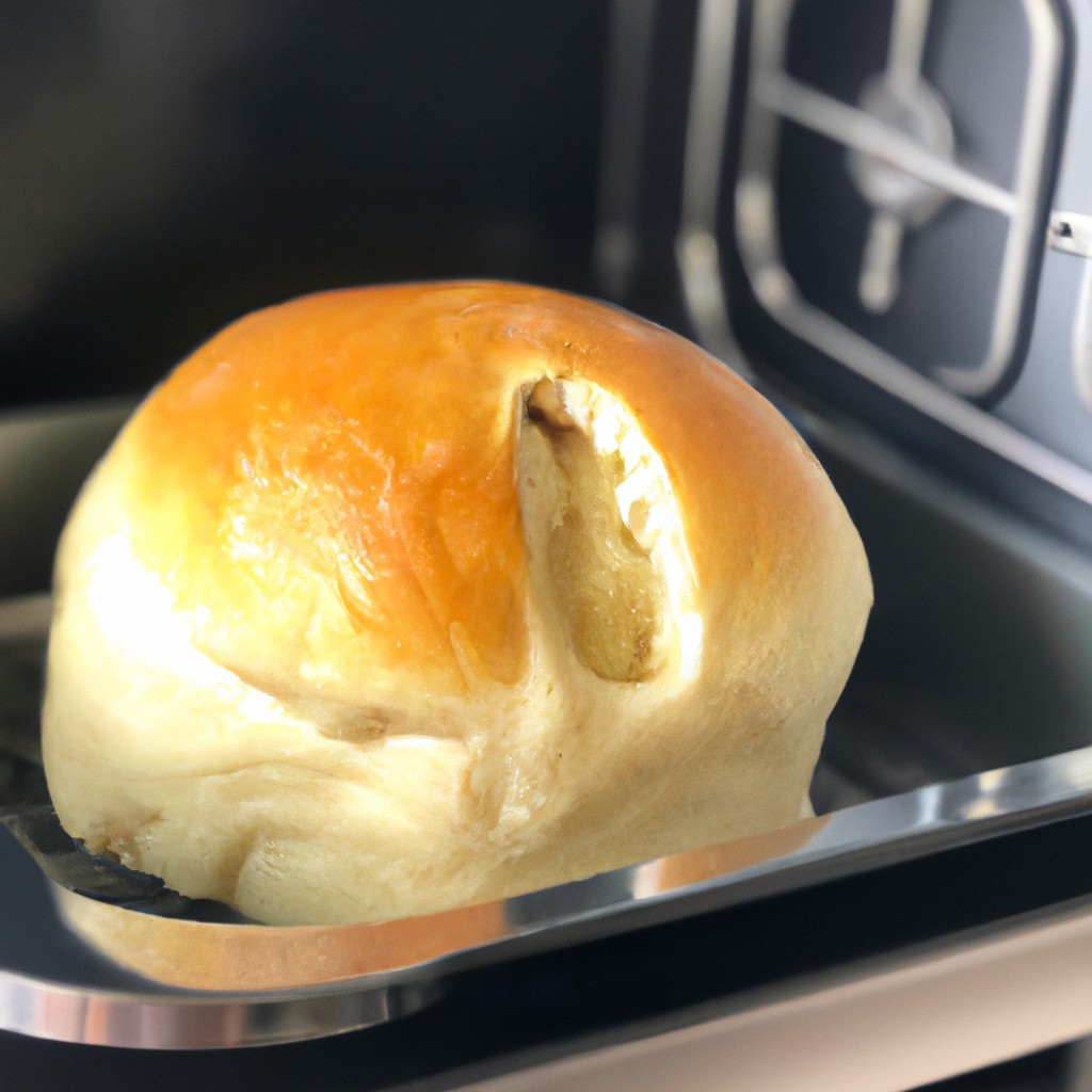 Pão Francês Com Requeijão Na Airfryer: Receita Fácil De Fazer 1 Uma foto de um pão francês crocante e dourado dividido ao meio, com um recheio generoso de requeijão cremoso e derretido. O pão é assado em uma Airfryer, o que lhe confere uma textura exterior crocante e um interior macio e fofo.