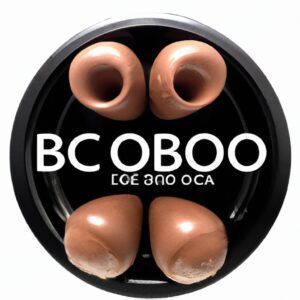 Imagem de um prato de Pastel de Chocolate na Airfryer com Formato de Bombom. Os pastéis são marrons escuros e têm formato de bombom, com um recheio cremoso de chocolate visível. Eles são polvilhados com açúcar de confeiteiro e servidos em um prato branco.