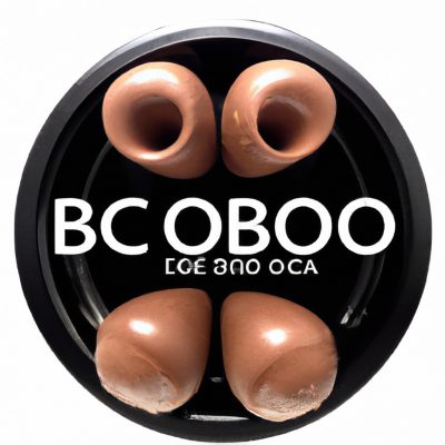 Imagem de um prato de Pastel de Chocolate na Airfryer com Formato de Bombom. Os pastéis são marrons escuros e têm formato de bombom, com um recheio cremoso de chocolate visível. Eles são polvilhados com açúcar de confeiteiro e servidos em um prato branco.