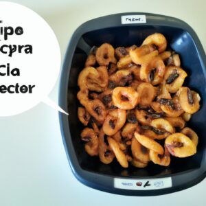 Imagem de uma porção de petiscos de feijão crocantes e dourados em uma cesta da airfryer. Os petiscos têm uma crosta crocante e um interior macio, com feijão preto e especiarias visíveis.