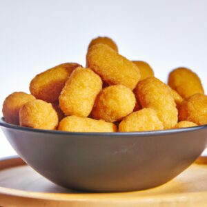 Uma imagem de uma Airfryer com várias comidas diferentes dentro, incluindo frango, batata frita e legumes. O texto na imagem diz "Airfryer: a maneira mais fácil de cozinhar alimentos deliciosos e saudáveis".