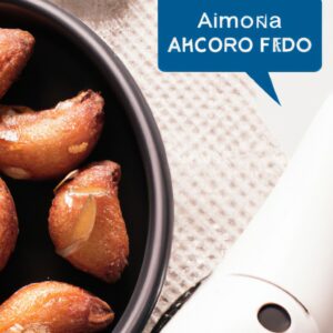 Imagem de almôndegas douradas e crocantes cozidas em uma airfryer, servidas em um prato com um molho de tomate vermelho ao lado.