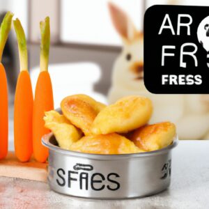 Coelhinhos de Páscoa crocantes e dourados preparados em uma airfryer. Eles têm cenouras de cenoura e orelhas de biscoito de açúcar, criando uma apresentação fofa e festiva.