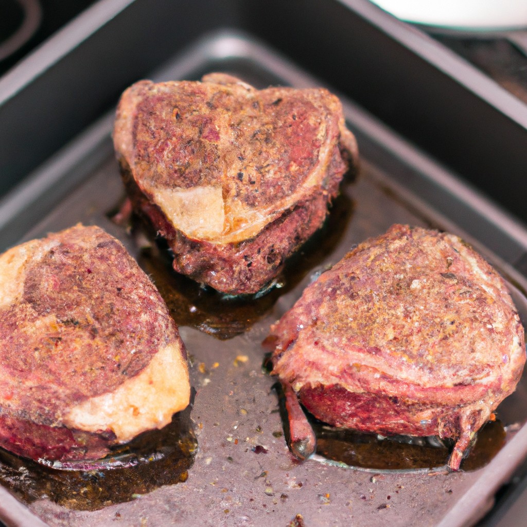 Como Preparar Carnes Em Bifes Ou Filés Na Airfryer 1 Imagem de bifes ou filés grelhados em uma Airfryer, com legumes grelhados ao lado. Os bifes são dourados e suculentos, e os legumes são macios e levemente caramelizados. A imagem transmite a facilidade e conveniência de preparar carnes na Airfryer, resultando em uma refeição saborosa e saudável.