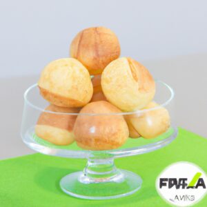 Imagem de pães de queijo dourados e crocantes, recém-saídos da airfryer. Os pães de queijo estão dispostos em um prato, prontos para serem apreciados.
