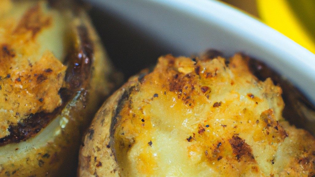 Imagem de petiscos de azeitonas empanadas e douradas em uma airfryer, conhecidos como 