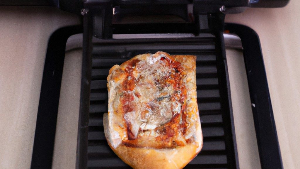 Pizza Pan (Pizza Hut) Na Airfryer 1 Pizza Hut Pizza Pan colocada em uma Airfryer, pronta para ser cozida. A Pizza Pan é redonda e preta, com uma crosta crocante por fora e queijo derretido e coberturas por cima.