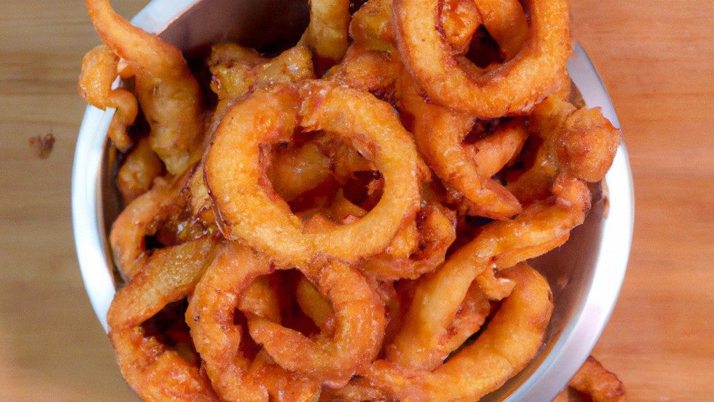 Imagem de rabanadas salgadas crocantes e douradas cozidas em airfryer, servidas em um prato com ervas frescas e molho de sua escolha.