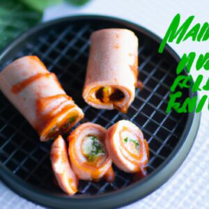 Imagem de rolinhos primavera crocantes e dourados cozidos na airfryer, servidos com um molho de imersão. Esses harumakis caseiros são uma opção de aperitivo deliciosa e fácil de fazer, com recheio de legumes e carne moída, envoltos em uma crosta crocante.